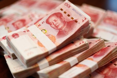 Bundles,Of,Renminbi.,Chairman,Mao,Zedong's,Portrait,On,The,Background