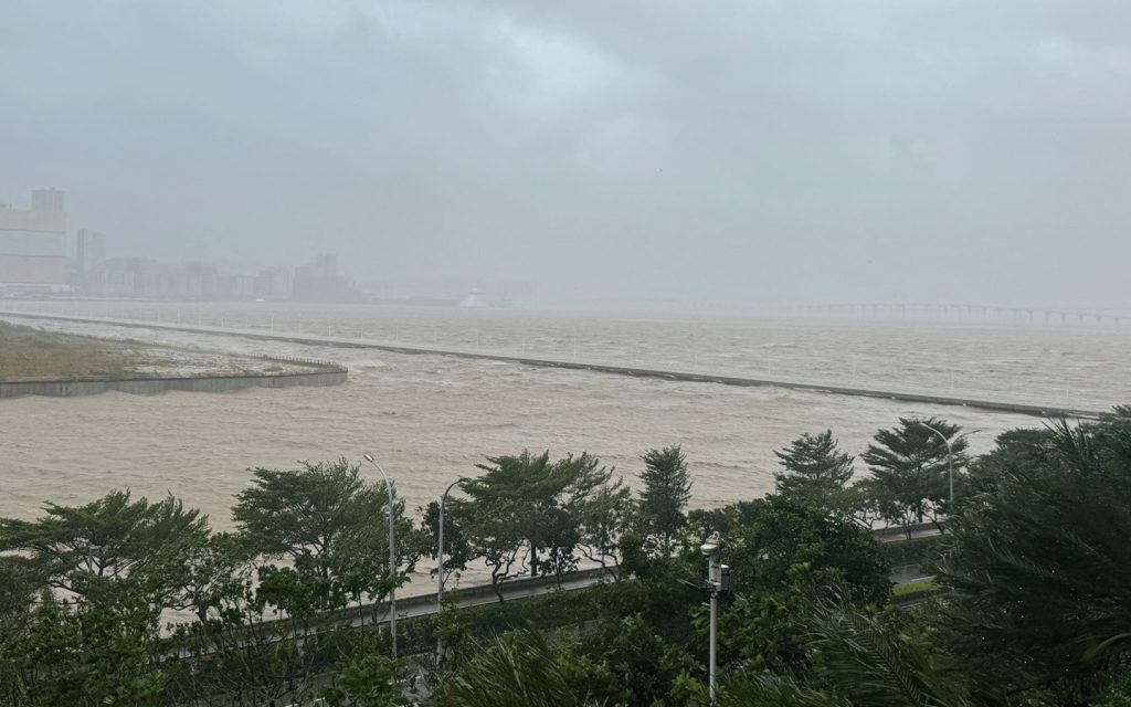Waves breaking over Governador Nobre de Carvalho Bridge approach road