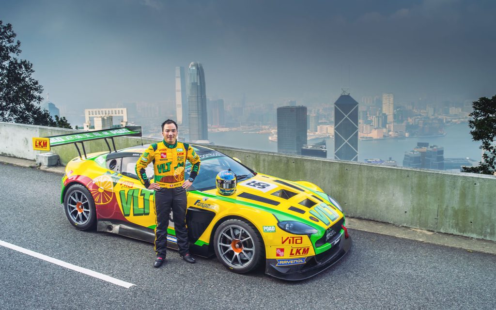 Darryl O’Young posing with his race car early in his career
