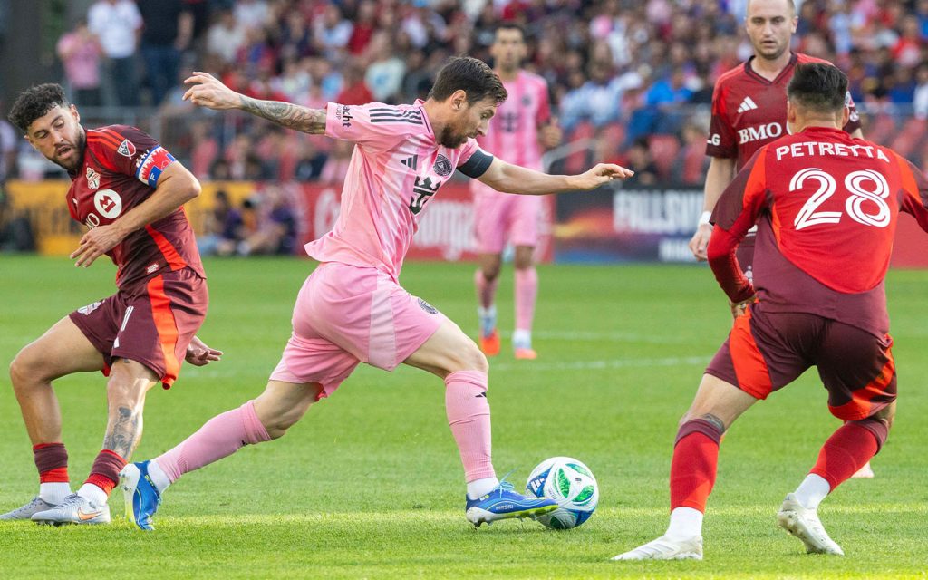 Inter Miami’s Lionel Messi (centre) cuts through during an MLS match against Toronto FC on 27 September 2025