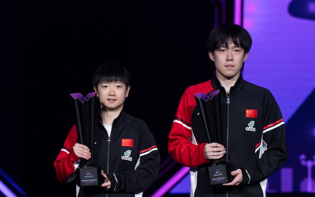 Sun Yingsha and Wang Chuqin pose with their trophies after being crowned singles champions at WTT Champions Macao 2025