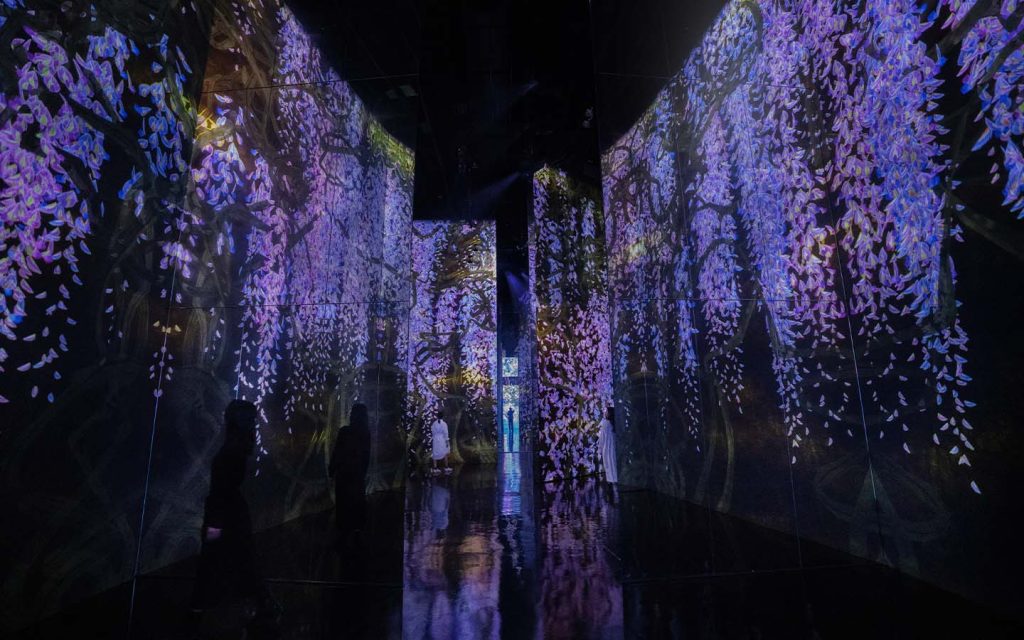 Visitors wander through shifting digital environments where light and movement respond in real time
