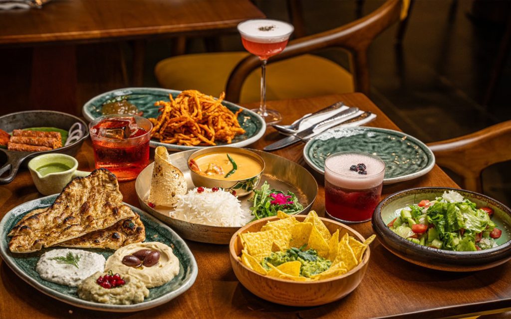 Indian-inspired small plates and cocktails designed for sharing in a lively evening atmosphere