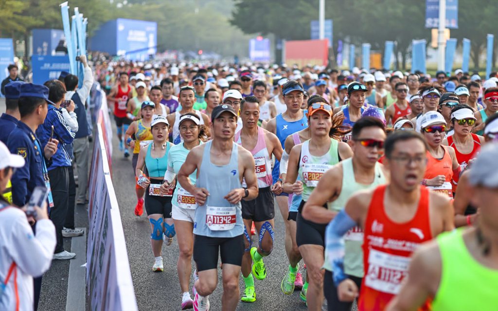 Elite and amateur runners compete along Shenzhen’s modern cityscape during the Shenzhen Marathon
