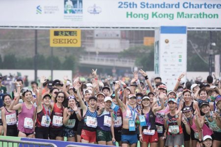 Participants of the 2023 Standard Chartered Marathon in Hong Kong pose for a group photo at the finish line Participants of the 2023 Standard Chartered Marathon in Hong Kong pose for a group photo at the finish line