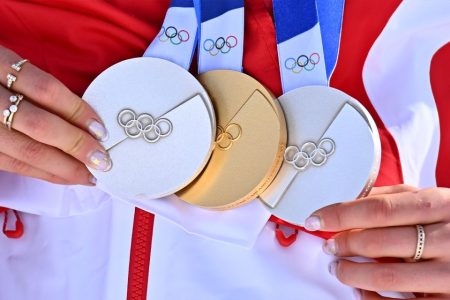 Gu Ailing and Wang Xindi lead China to five golds at Milano-Cortina 2026 - Gold medalist Gu Ailing of China shows her medals after the awarding ceremony for freestyle skiing women's freeski halfpipe at the Milan-Cortina 2026 Olympic Winter Games on 22 February 2026