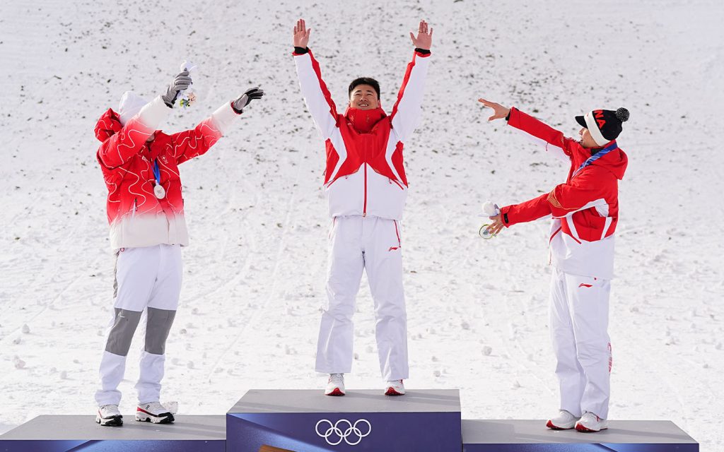 Gu Ailing and Wang Xindi lead China to five golds at Milano-Cortina 2026 - Gold medalist Wang Xindi (centre) of China celebrates during the awarding ceremony of the freestyle skiing men's aerials at the Milan-Cortina 2026 Olympic Winter Games on 20 February 2026