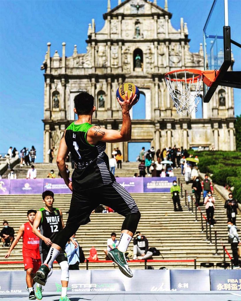 Lai rises for a shot in front of the Ruins of St. Paul’s during a 3x3 basketball showcase in Macao